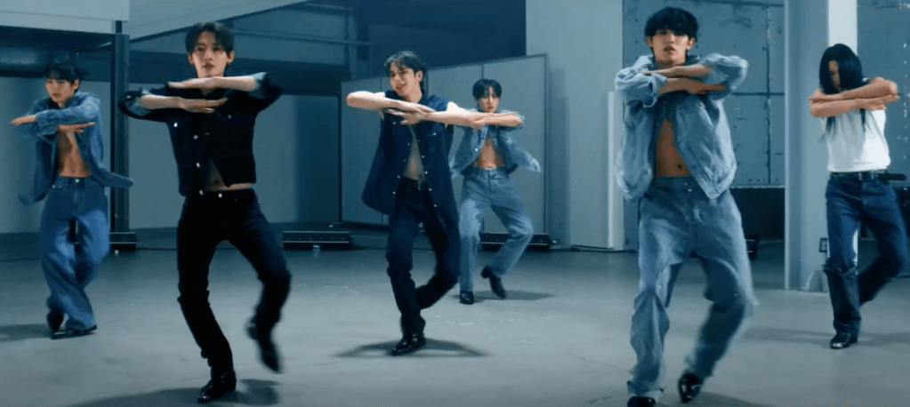 Cena do MV de "dOpamine" do álbum Things I Can't Say I Love com os membros do OnlyOneOf dançando