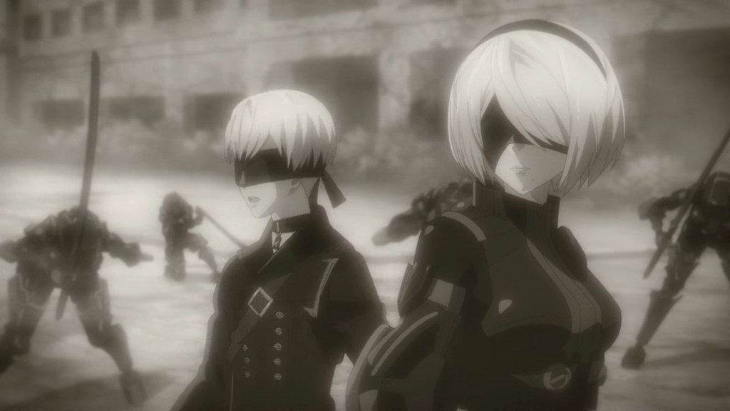 Cena do anime NieR: Automata Ver1.1A com 2B e 9S prontos para entrar em combate, enquanto estão cercados por inimigos