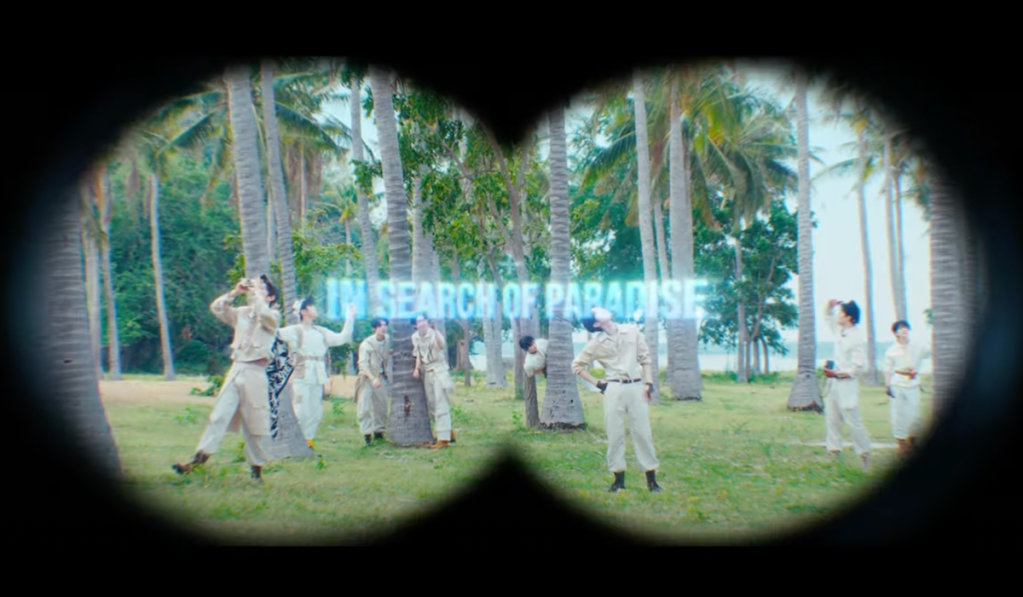 Cena do MV de "BLUE" do álbum Blue Paradise do ZB1, simulando a visão de um binóculo com a frase 'in search of paradise'