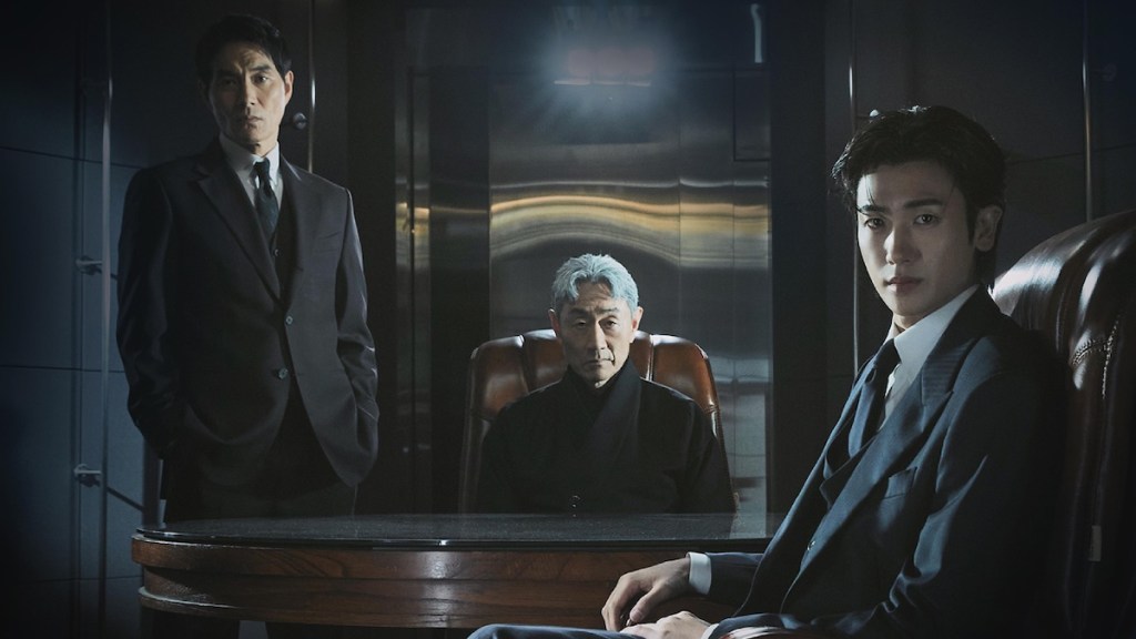 Cena do K-Drama Buried Hearts em uma sala escura com Lee Hae-Young, Yeom Jang-Sun e Park Hyung-Sik